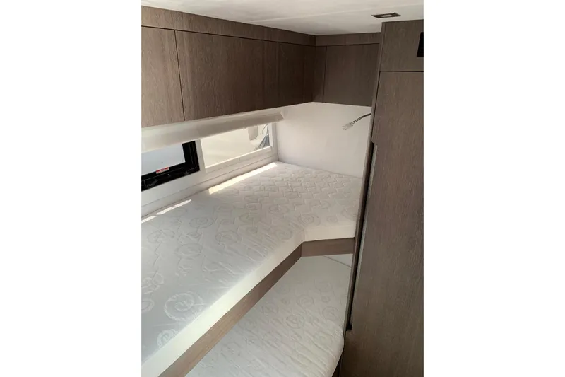 Yacht Photos Pics 2019 Galeon 500 Fly yacht interior with bunk beds and wooden cabinetry.
