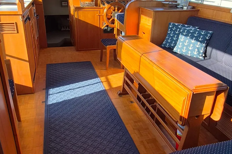 Lan Mara Yacht Photos Pics Interior of 1987 Grand Banks 42 Classic Trawler, featuring wood finish and nautical decor.