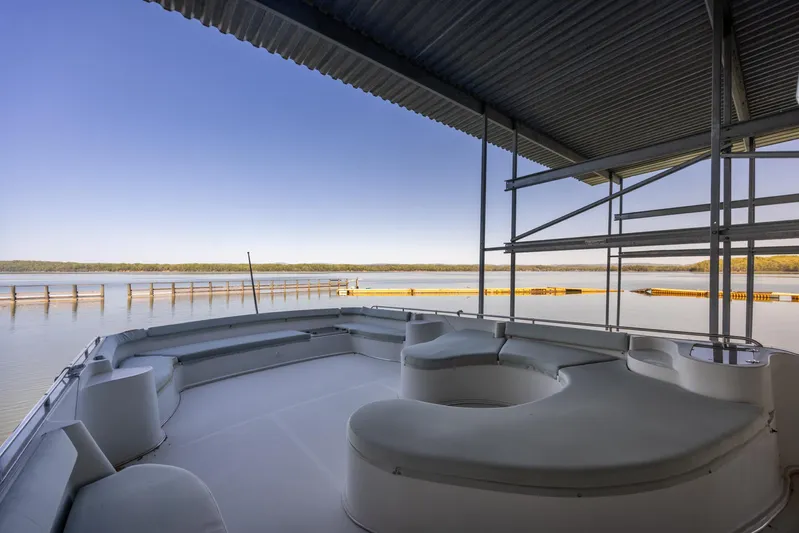  Yacht Photos Pics Spacious deck of 1990 Bluewater Yachts 55 Yacht with serene waterfront view.