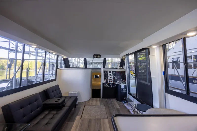  Yacht Photos Pics Interior of 1990 Bluewater Yachts 55 Yacht, featuring spacious seating and large windows.