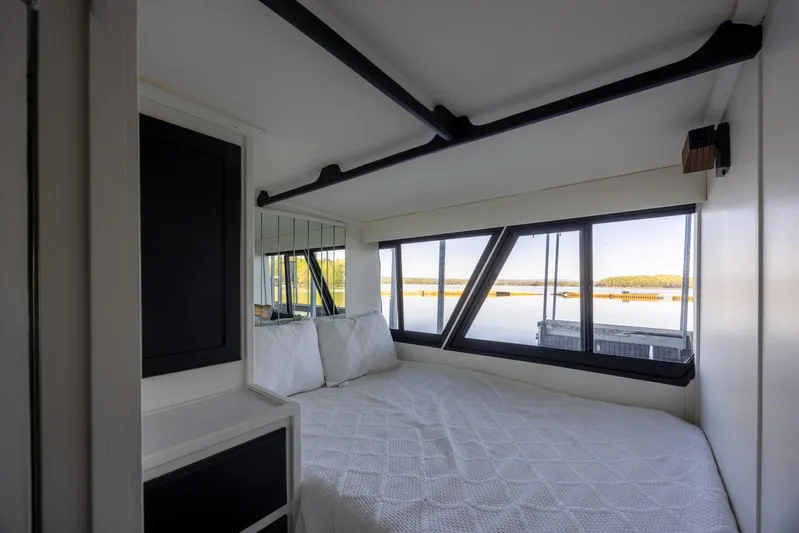  Yacht Photos Pics Bedroom interior of 1990 Bluewater Yachts 55 Yacht with scenic window view.