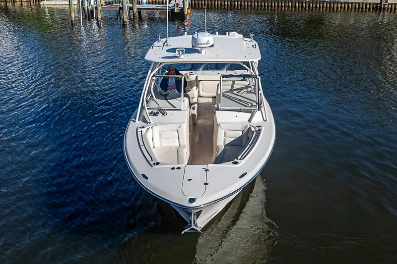 Sundae Funday Yacht Photos Pics 2017 Grady-White Freedom 307 boat on calm water, aerial view.