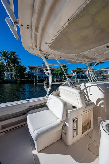 Sundae Funday Yacht Photos Pics 2017 Grady-White Freedom 307 boat interior with seating, dockside view, and clear blue sky.