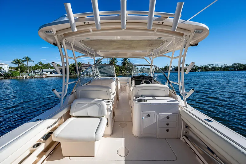 Sundae Funday Yacht Photos Pics 2017 Grady-White Freedom 307 boat interior with seating, on a sunny day by the water.