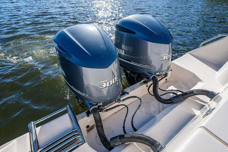Sundae Funday Yacht Photos Pics Twin Yamaha 300 engines on a 2017 Grady-White Freedom 307 boat in water.