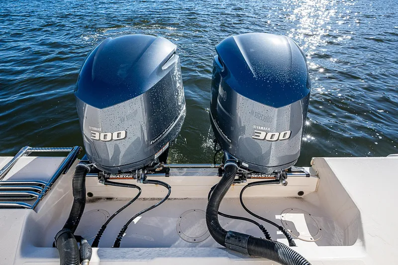 Sundae Funday Yacht Photos Pics Twin Yamaha 300 engines on a 2017 Grady-White Freedom 307 boat, glistening on the water.