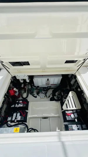 Twin J Yacht Photos Pics 2021 Boston Whaler 420 Outrage engine compartment with batteries and electrical components.