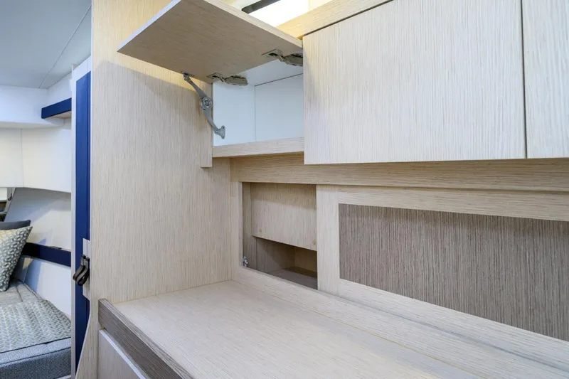  Yacht Photos Pics Interior of 2025 Apreamare GOZZO 35 yacht with modern wooden cabinetry design.