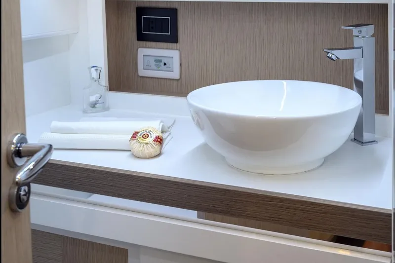 Yacht Photos Pics Modern bathroom sink on Apreamare GOZZO 35 yacht, featuring sleek design and elegant fixtures.