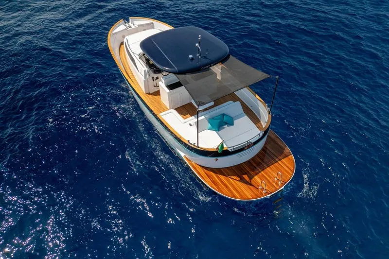  Yacht Photos Pics 2025 Apreamare GOZZO 35 luxury yacht cruising on clear blue water.