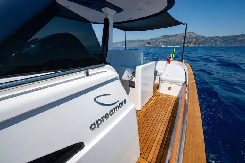  Yacht Photos Pics 2025 Apreamare GOZZO 35 yacht on open sea, featuring sleek design and wooden deck.