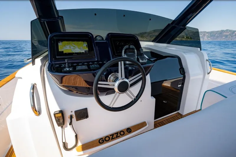  Yacht Photos Pics 2025 Apreamare GOZZO 35 boat cockpit with modern navigation system and steering wheel.