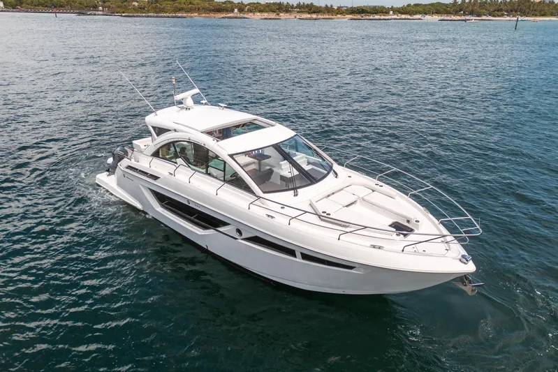Risky Business Yacht Photos Pics 2019 Cruisers Yachts Cantius on open water, showcasing sleek design and luxury features.