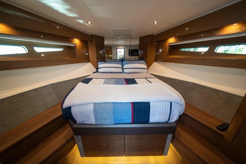 Risky Business Yacht Photos Pics Luxurious 2019 Cruisers Yachts Cantius bedroom interior with modern design and cozy bedding.