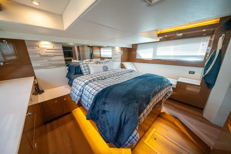 Risky Business Yacht Photos Pics Luxurious 2019 Cruisers Yachts Cantius bedroom with modern decor and ambient lighting.