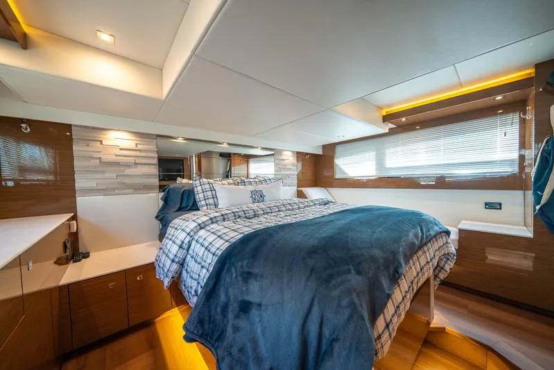 Risky Business Yacht Photos Pics Luxurious 2019 Cruisers Yachts Cantius bedroom with modern decor and cozy bedding.