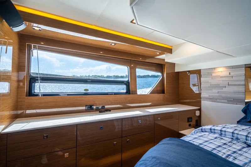 Risky Business Yacht Photos Pics Luxurious 2019 Cruisers Yachts Cantius cabin interior with large window and modern wood finish.