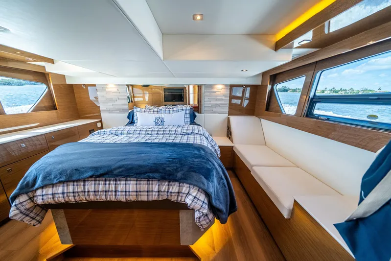 Risky Business Yacht Photos Pics Luxurious 2019 Cruisers Yachts Cantius bedroom with elegant wood finish and scenic windows.