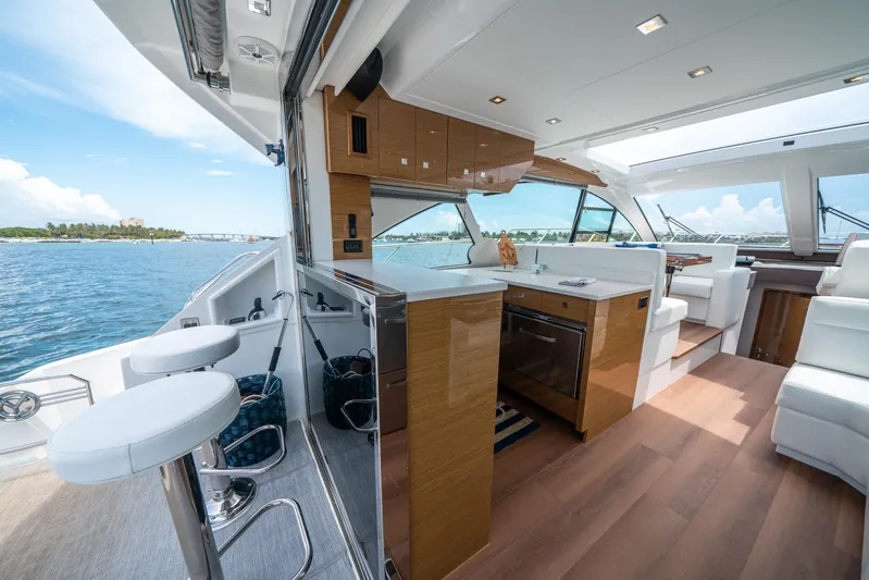 Risky Business Yacht Photos Pics Luxurious 2019 Cruisers Yachts Cantius interior with modern kitchen and scenic ocean view.