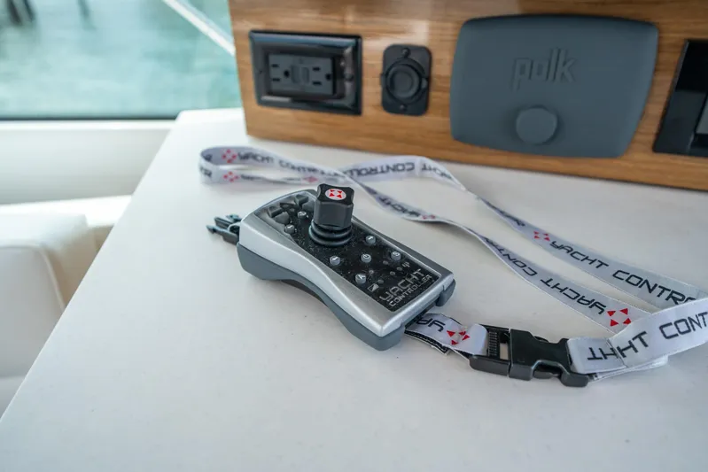 Risky Business Yacht Photos Pics Remote control on a 2019 Cruisers Yachts Cantius, featuring yacht control lanyard.