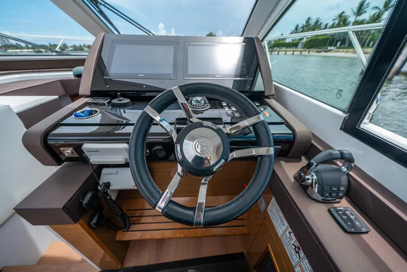 Risky Business Yacht Photos Pics 2019 Cruisers Yachts Cantius helm with modern controls and dual displays.