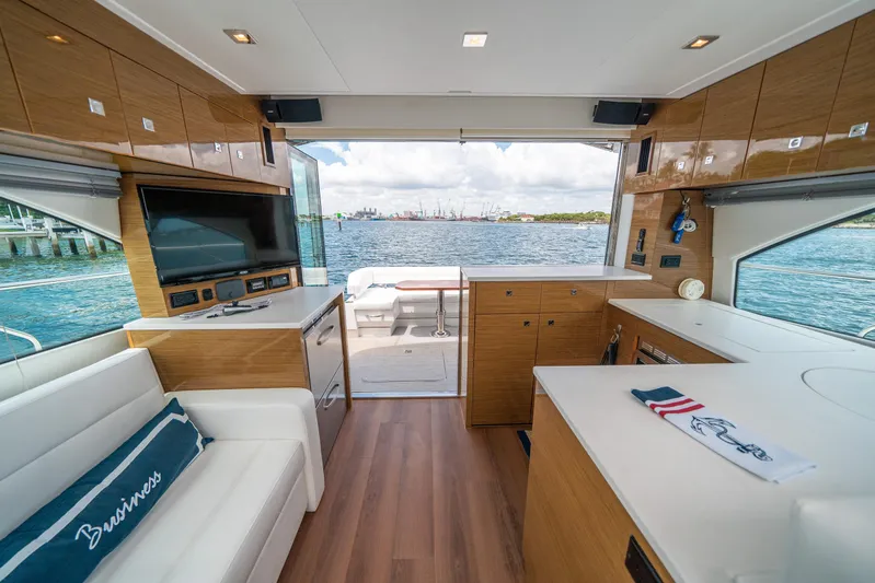 Risky Business Yacht Photos Pics Luxurious 2019 Cruisers Yachts Cantius interior with modern amenities and stunning ocean view.