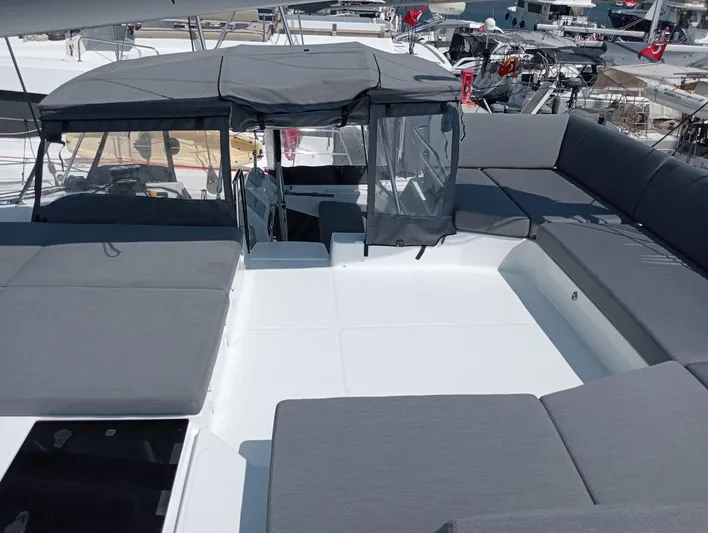  Yacht Photos Pics 2023 Fountaine Pajot Tanna 47 yacht with spacious deck and seating area.