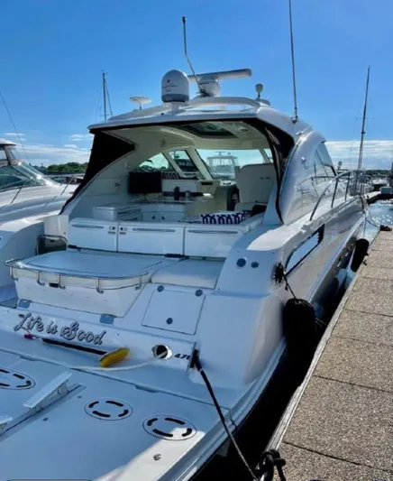  Yacht Photos Pics 2011 Sea Ray 470 Sundancer yacht docked under clear blue sky.
