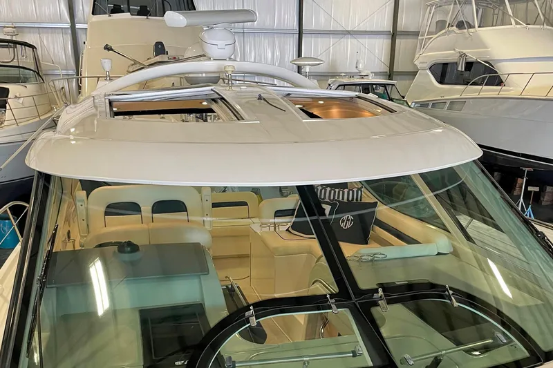  Yacht Photos Pics 2011 Sea Ray 470 Sundancer yacht in a marina, showcasing sleek design and spacious interior.