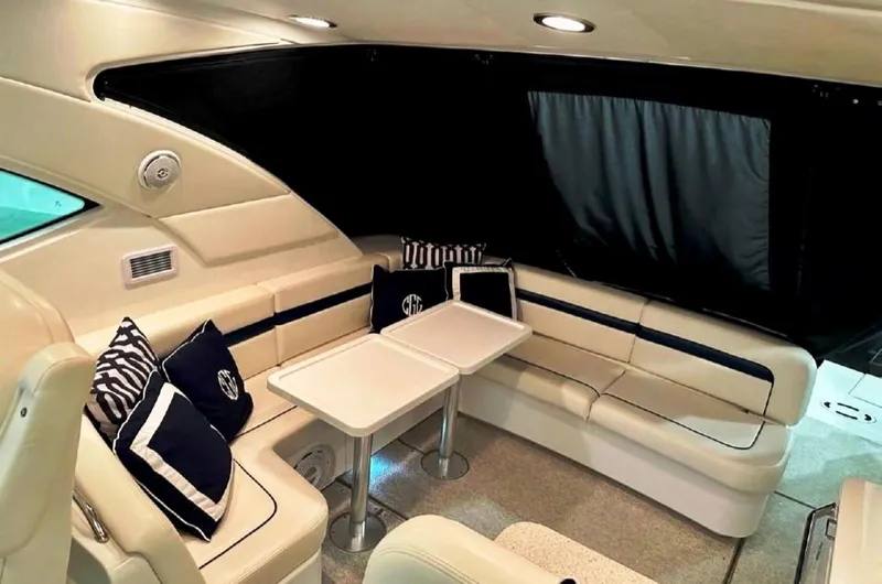  Yacht Photos Pics Luxurious interior of 2011 Sea Ray 470 Sundancer yacht with elegant seating and tables.