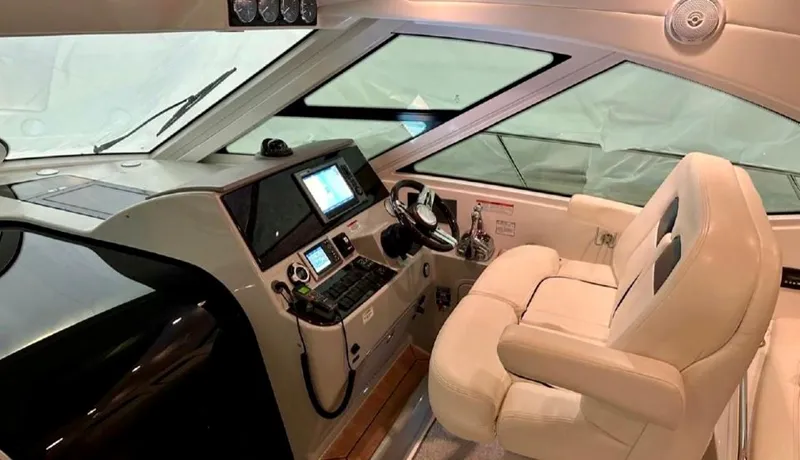  Yacht Photos Pics 2011 Sea Ray 470 Sundancer helm with modern controls and comfortable seating.