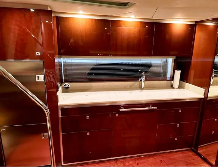  Yacht Photos Pics Luxurious kitchen interior of 2011 Sea Ray 470 Sundancer yacht with sleek cabinetry.