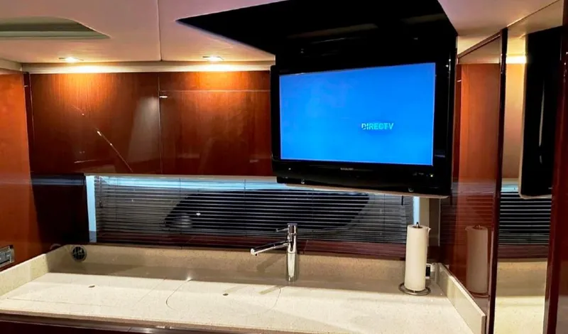  Yacht Photos Pics Luxurious interior of 2011 Sea Ray 470 Sundancer with TV and modern sink.