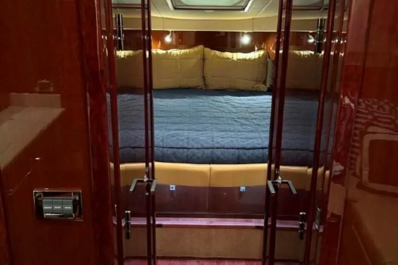  Yacht Photos Pics Luxurious cabin interior of 2011 Sea Ray 470 Sundancer yacht with plush bedding.