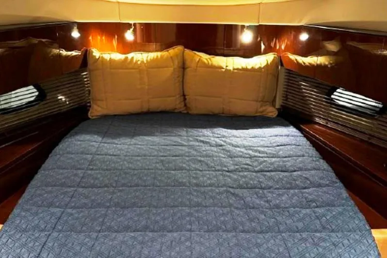  Yacht Photos Pics Luxurious cabin interior of 2011 Sea Ray 470 Sundancer with cozy bedding.