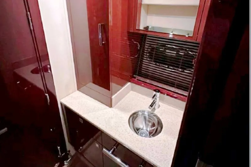  Yacht Photos Pics Luxurious bathroom interior of 2011 Sea Ray 470 Sundancer yacht with modern sink and cabinetry.