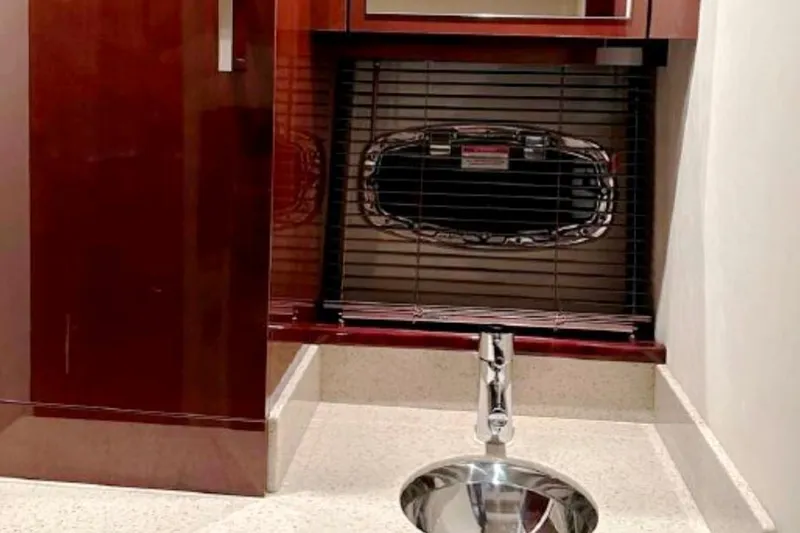  Yacht Photos Pics Luxurious bathroom interior of 2011 Sea Ray 470 Sundancer yacht with sleek sink and cabinetry.