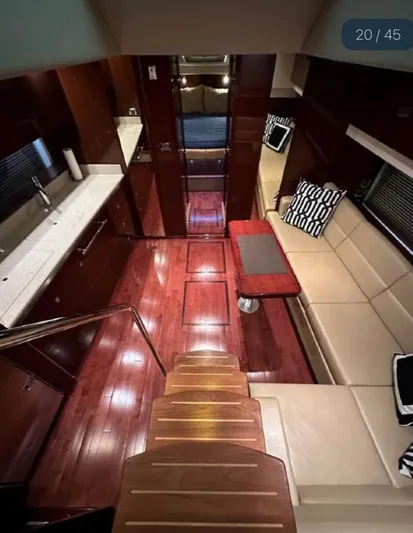  Yacht Photos Pics Interior of 2011 Sea Ray 470 Sundancer yacht with elegant wood flooring and modern seating.