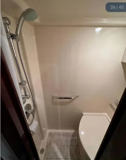  Yacht Photos Pics Bathroom interior of 2011 Sea Ray 470 Sundancer yacht with shower and toilet.