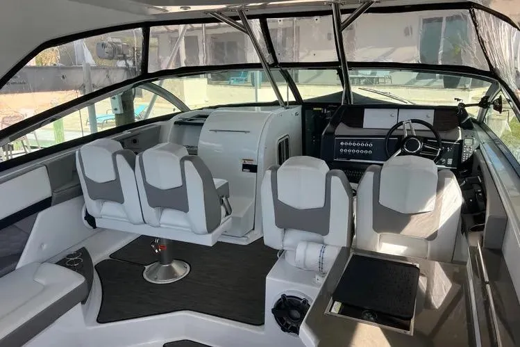  Yacht Photos Pics 2023 Four Winns H350 OB boat interior with modern seating and control panel.