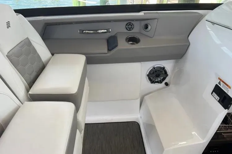  Yacht Photos Pics 2023 Four Winns H350 OB boat interior with cushioned seating and modern design elements.