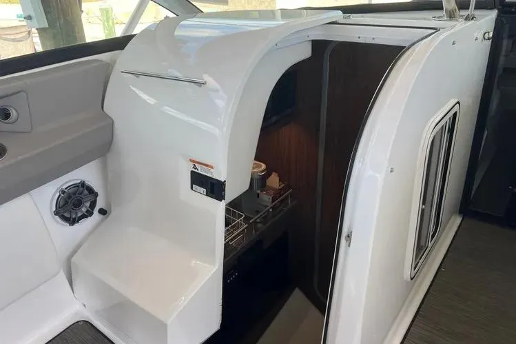  Yacht Photos Pics 2023 Four Winns H350 OB boat interior with sleek white cabinetry and modern amenities.