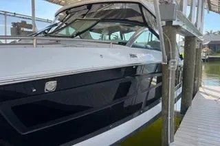  Yacht Photos Pics 2023 Four Winns H350 OB boat docked, showcasing sleek design and modern features.