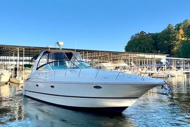 Partner Ship Yacht Photos Pics 2003 Cruisers Yachts 3772 Express docked at marina under clear blue sky.