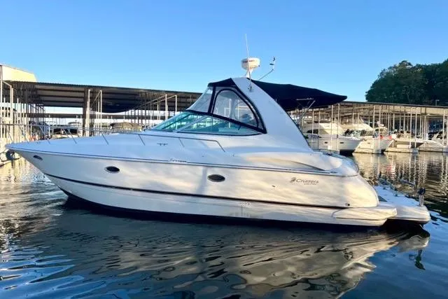 Partner Ship Yacht Photos Pics 2003 Cruisers Yachts 3772 Express docked in marina, side view.