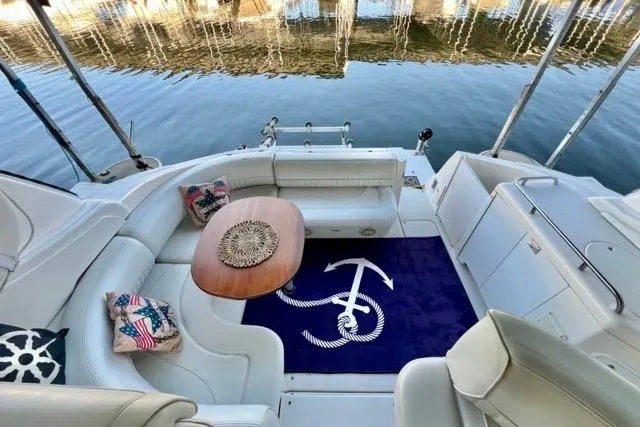 Partner Ship Yacht Photos Pics 2003 Cruisers Yachts 3772 Express interior with seating, table, and nautical-themed decor.