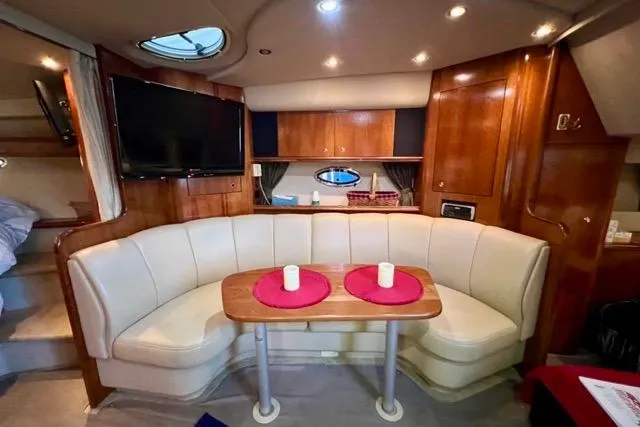Partner Ship Yacht Photos Pics Luxurious interior of 2003 Cruisers Yachts 3772 Express with plush seating and elegant wood finishes.