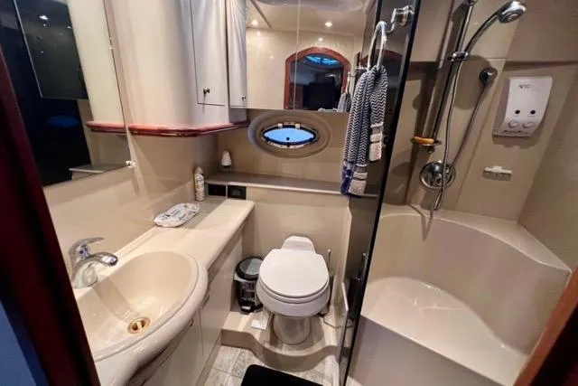 Partner Ship Yacht Photos Pics Luxurious bathroom in 2003 Cruisers Yachts 3772 Express with modern amenities and elegant design.