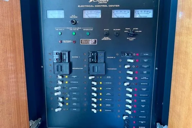 Partner Ship Yacht Photos Pics Electrical control panel of 2003 Cruisers Yachts 3772 Express, featuring switches and meters.