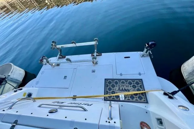 Partner Ship Yacht Photos Pics 2003 Cruisers Yachts 3772 Express docked, showing rear deck and water reflection.